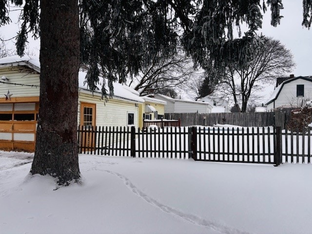 view of snow covered gate