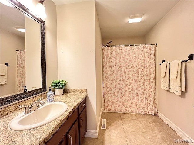 bathroom with vanity and tile patterned floors