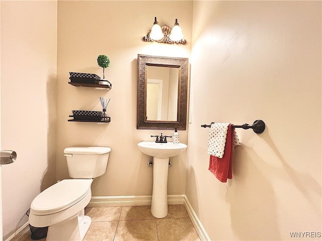 bathroom featuring sink, tile patterned flooring, and toilet