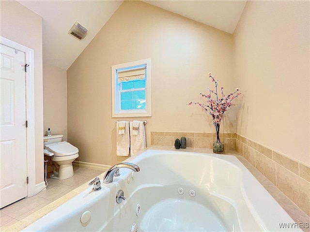 bathroom with toilet, tile patterned floors, a relaxing tiled tub, and vaulted ceiling