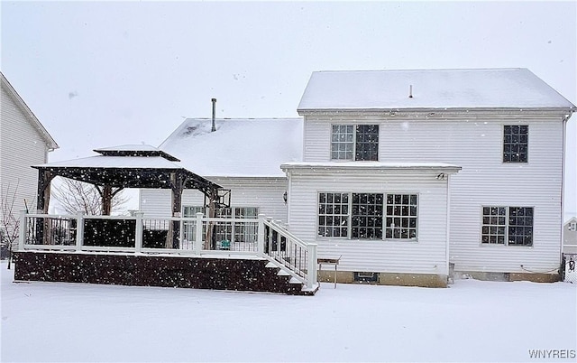 snow covered property with a gazebo