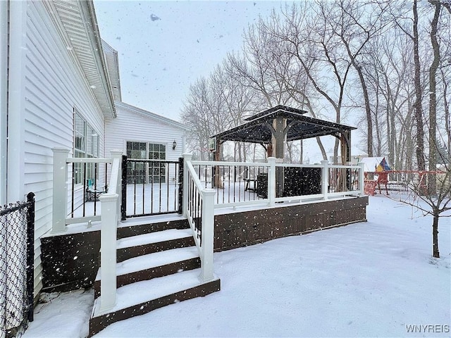 snow covered deck featuring a gazebo