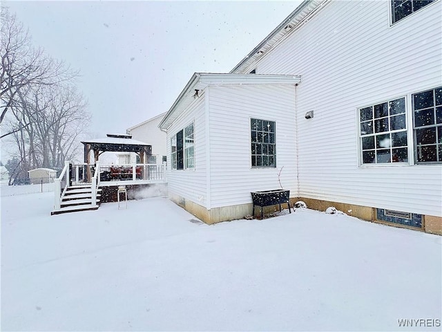 view of snowy exterior featuring a gazebo