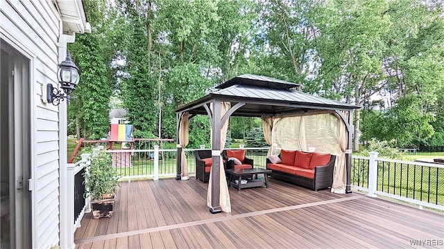 wooden terrace featuring a lawn, a gazebo, and outdoor lounge area