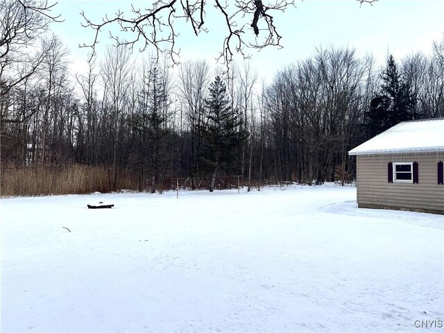 view of yard covered in snow