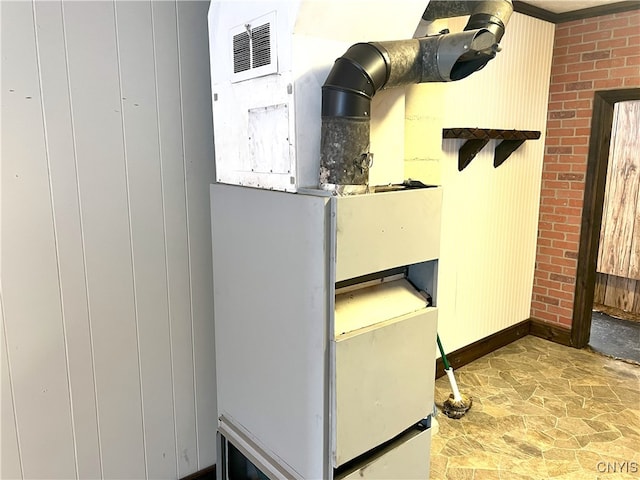 utility room with heating unit