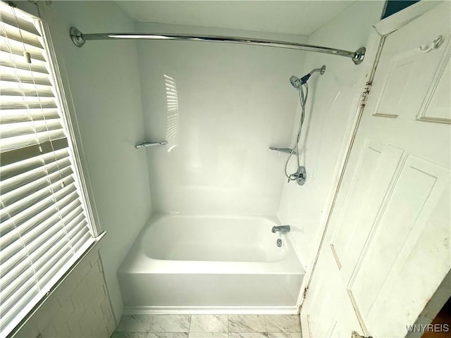 bathroom with washtub / shower combination