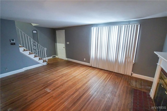 unfurnished living room with hardwood / wood-style floors