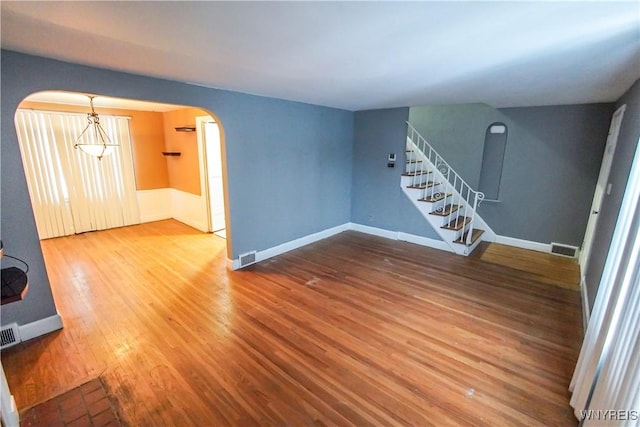 unfurnished living room featuring hardwood / wood-style floors