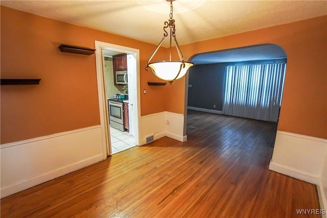 unfurnished dining area with hardwood / wood-style floors