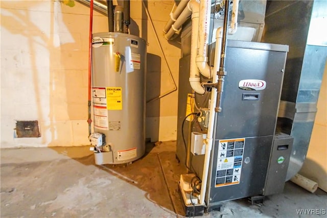 utility room featuring gas water heater and heating unit