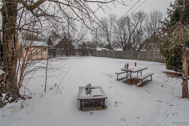 view of yard layered in snow