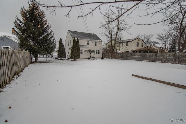 view of yard covered in snow