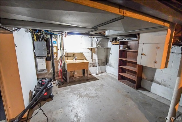 basement featuring electric panel