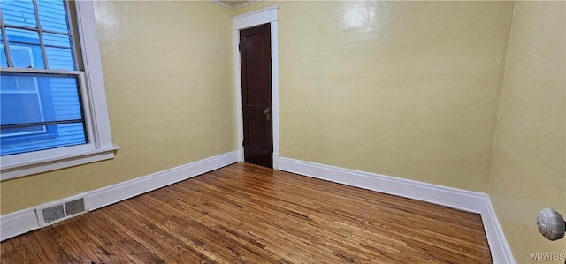 empty room featuring wood-type flooring