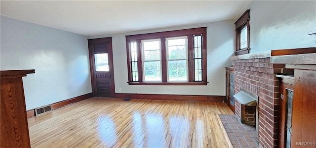 unfurnished living room featuring light hardwood / wood-style flooring