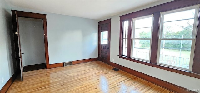 spare room with light hardwood / wood-style floors