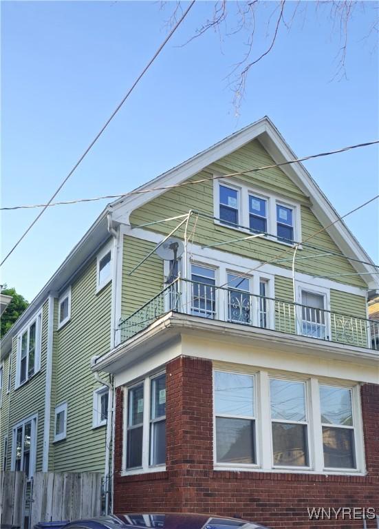 view of property exterior featuring a balcony