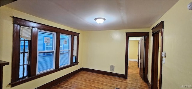 spare room with hardwood / wood-style floors