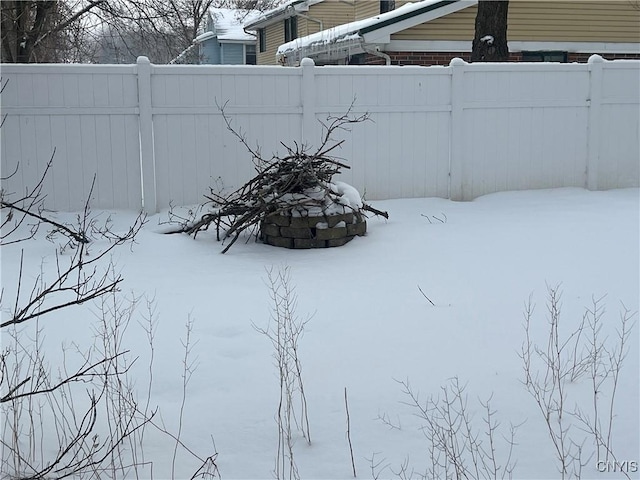 view of yard layered in snow