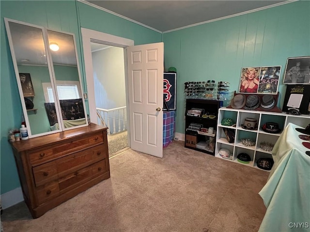 carpeted bedroom with a closet and crown molding