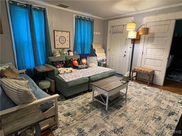 sitting room featuring crown molding