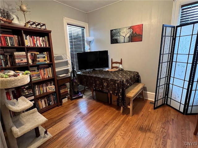 home office with wood-type flooring