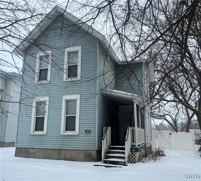 view of snow covered house