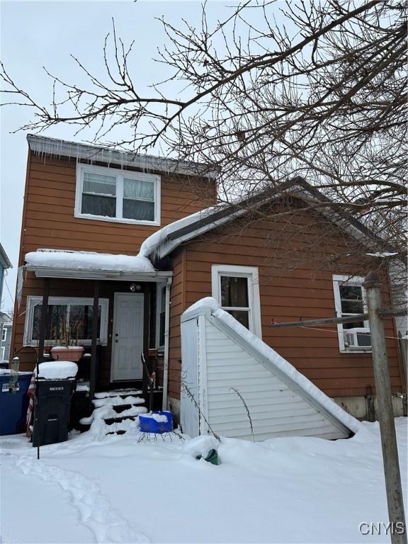 view of snow covered house