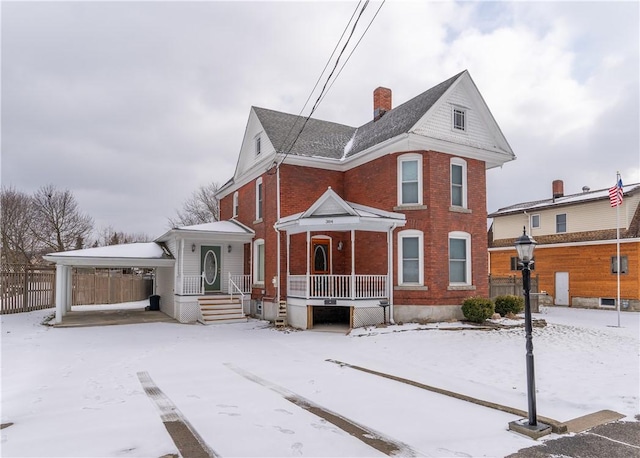 view of snow covered house