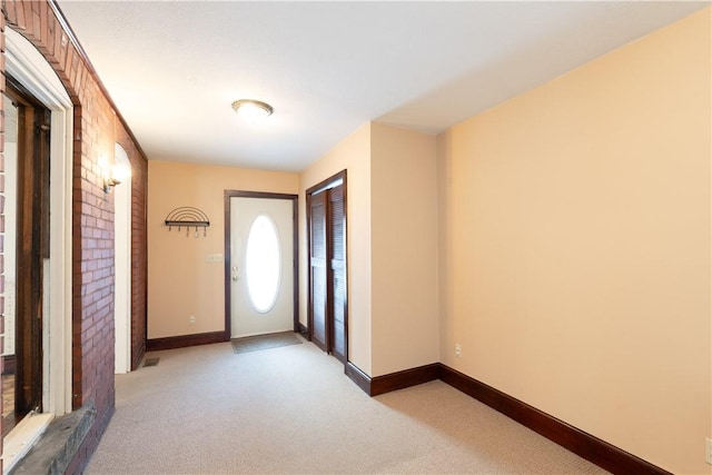 entrance foyer with light carpet