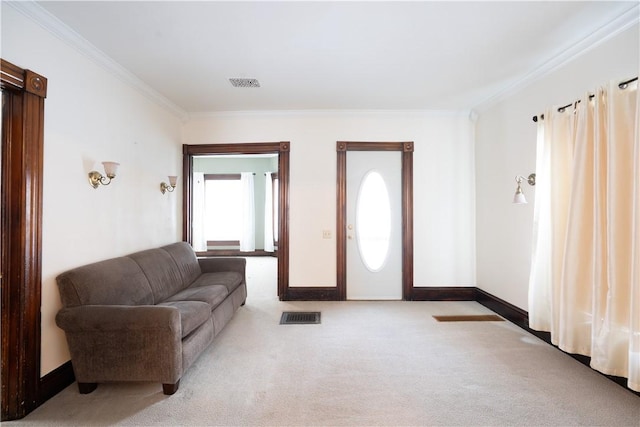 carpeted living room featuring ornamental molding