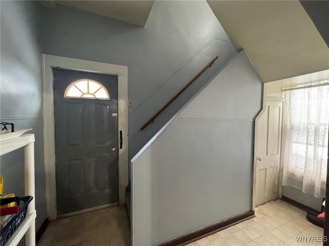 entrance foyer featuring lofted ceiling