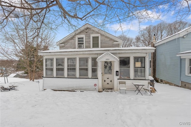 view of front of property featuring a sunroom