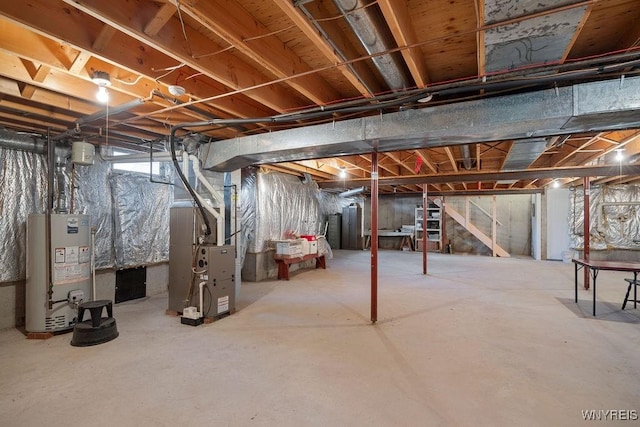 basement featuring heating unit and gas water heater