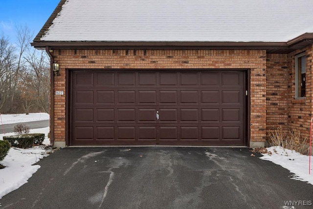 view of snow covered garage