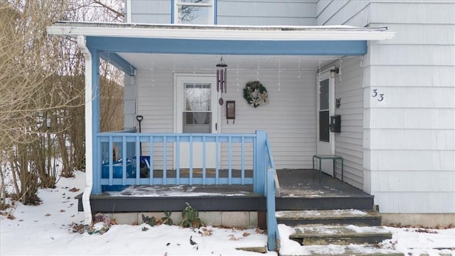 view of snow covered property entrance