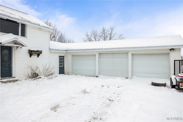 view of snow covered garage