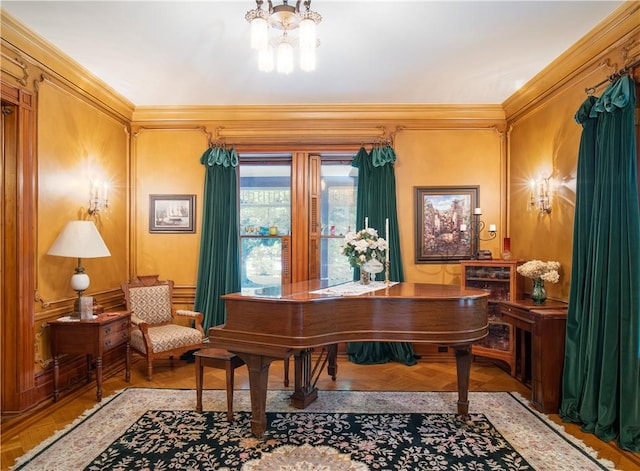 miscellaneous room with an inviting chandelier, crown molding, and light parquet flooring