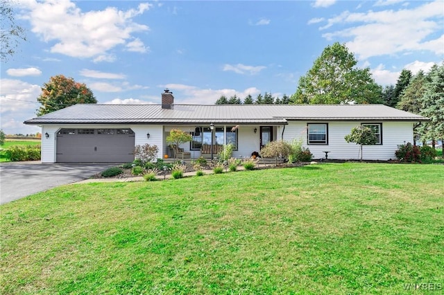 ranch-style house featuring a front lawn, a garage, and a porch