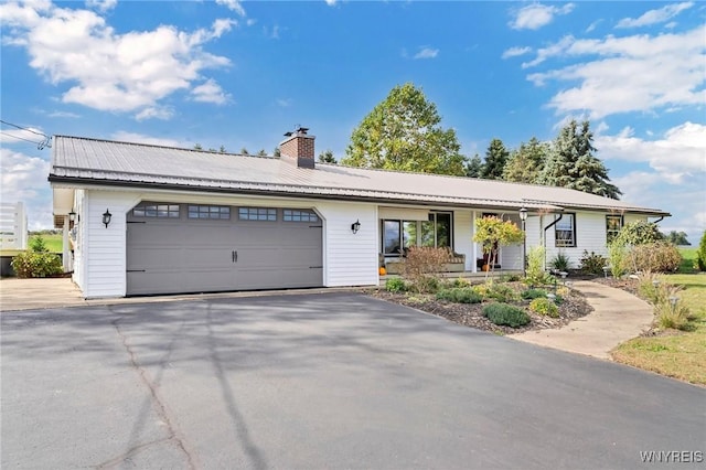 single story home featuring a garage