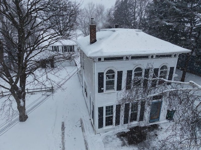 view of snow covered property