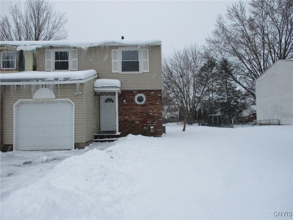 front facade with a garage