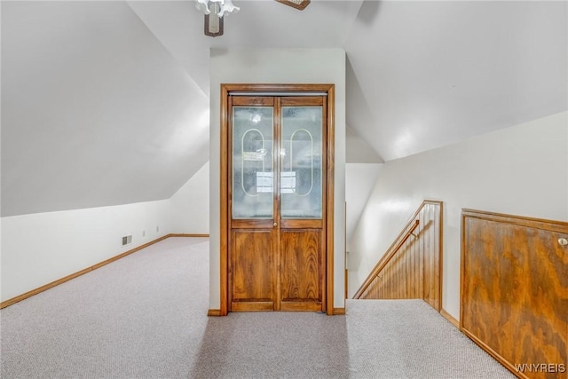 bonus room featuring carpet floors, ceiling fan, and lofted ceiling