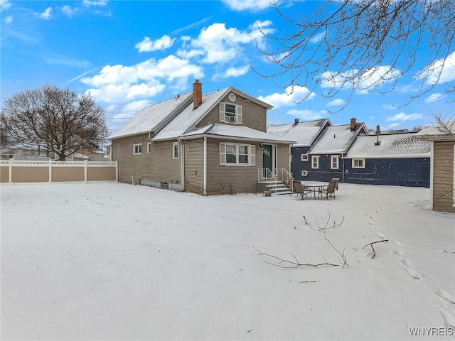 view of snow covered house