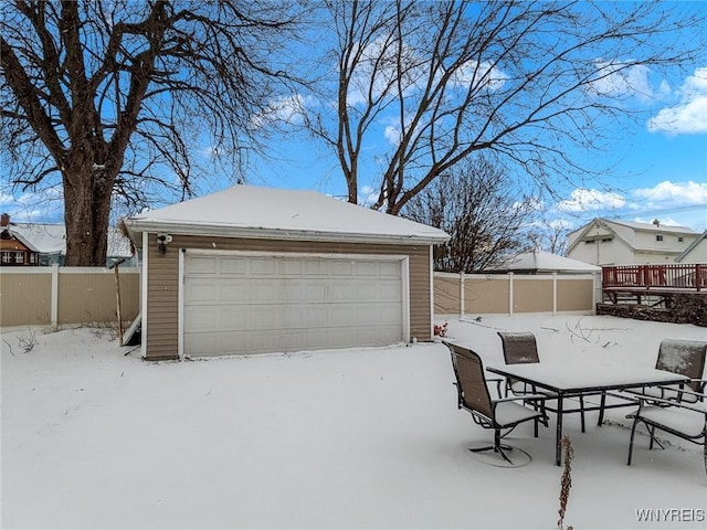 view of snow covered garage