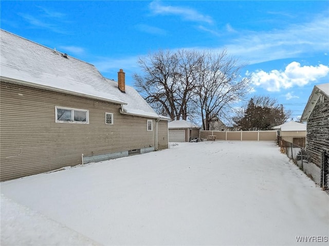 view of yard layered in snow