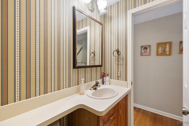 bathroom featuring hardwood / wood-style floors and vanity