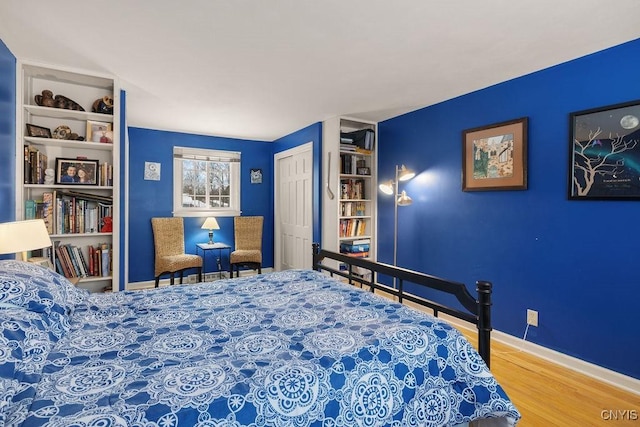 bedroom featuring a closet and hardwood / wood-style flooring