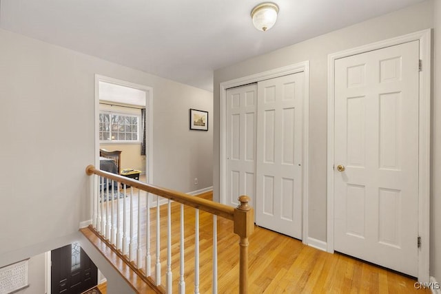 hall with light hardwood / wood-style flooring